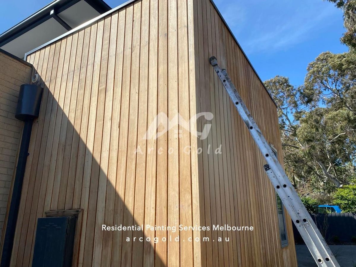Timber-clad facade being repainted at height
