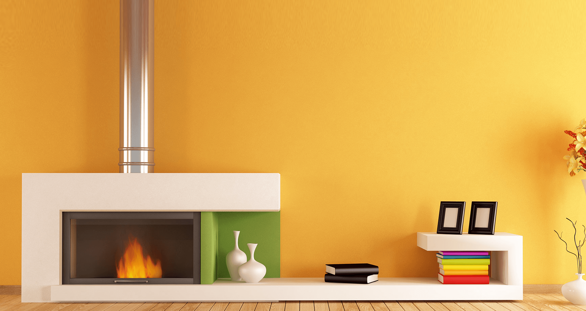 A living room wall in a deep marigold finish, lit by late afternoon sun